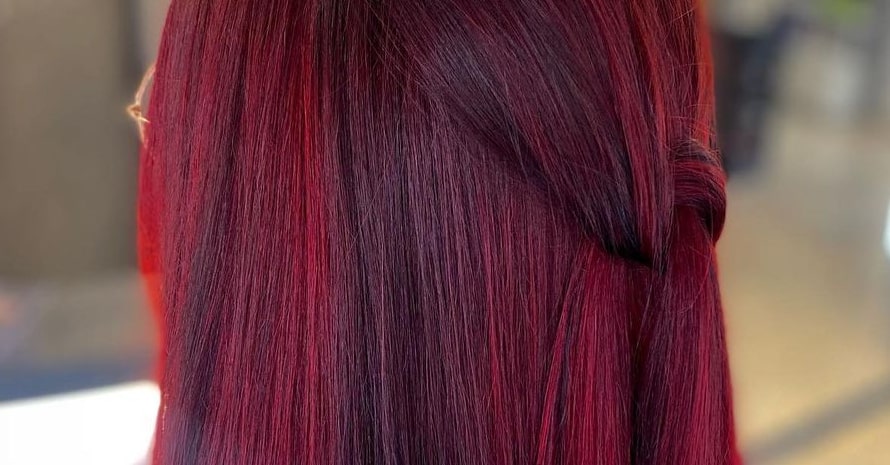 Red balayage on black hair